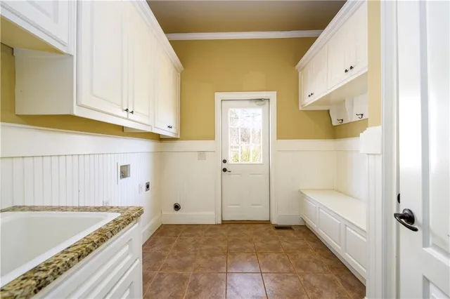a bathroom with a tub shower and mirror