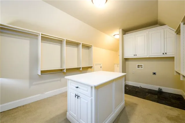 a kitchen with stainless steel appliances granite countertop wooden cabinets and a granite counter tops