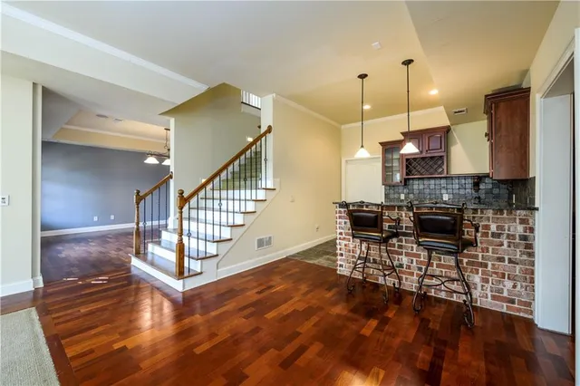 a view of a livingroom with furniture and wooden floor