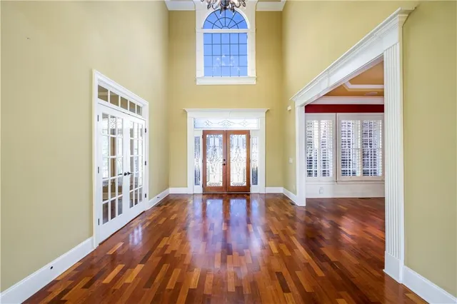 a view of an entryway with wooden floor