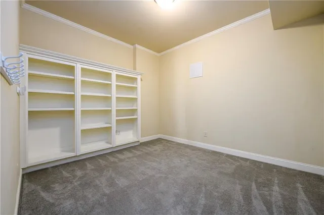 a view of a room with wooden walls