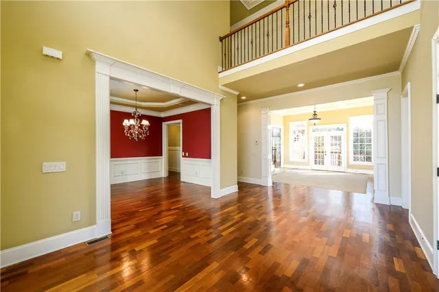 a view of an entryway with wooden floor