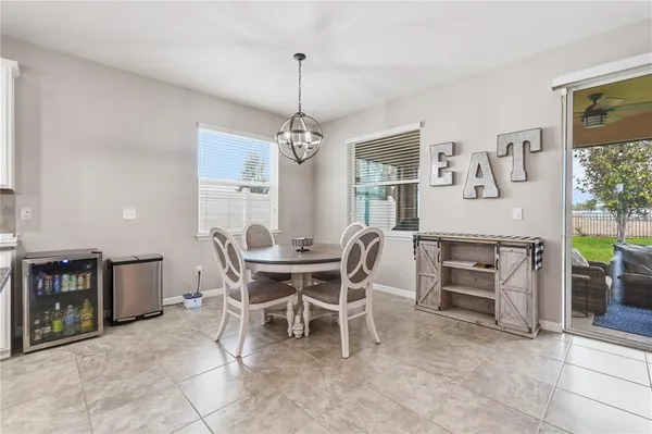 a dining room with furniture and window