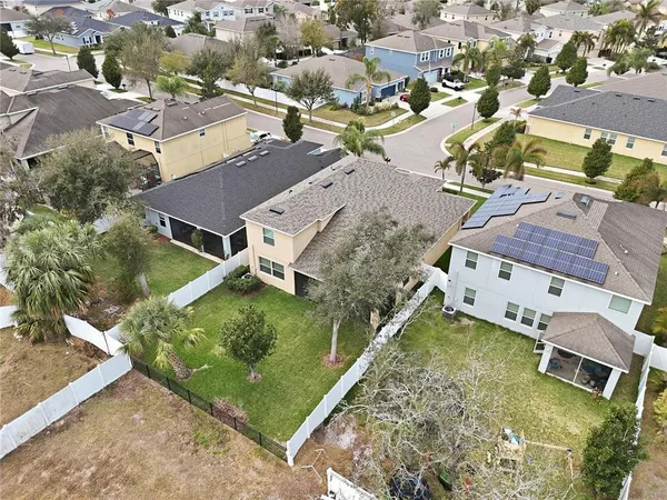 an aerial view of a house with a garden