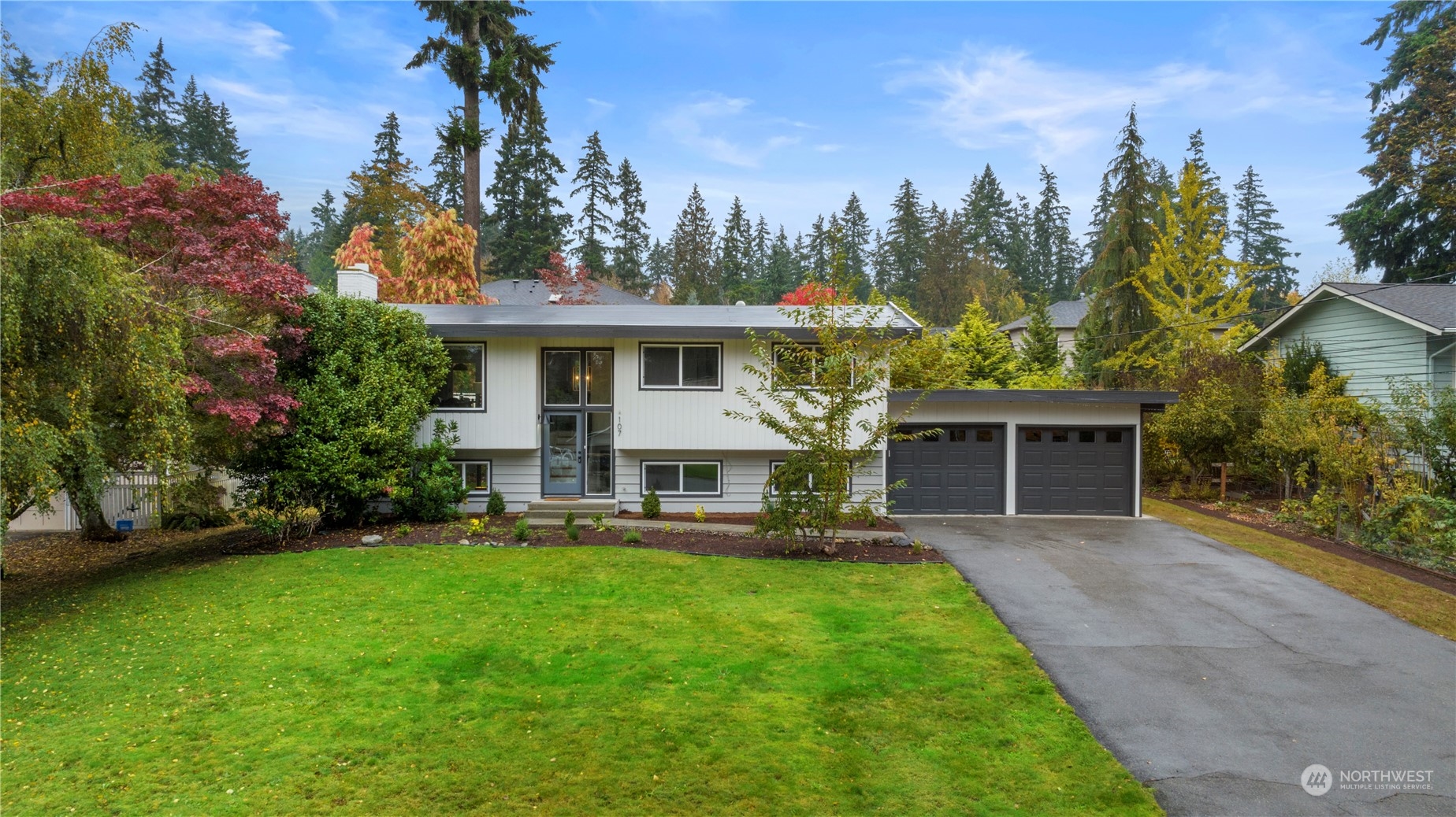107 234th Place Southeast Bothell, WA 98021 - Photo 1 of 37 a front view of a house with a yard garden and outdoor seating