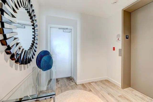 a view of entryway with wooden floor