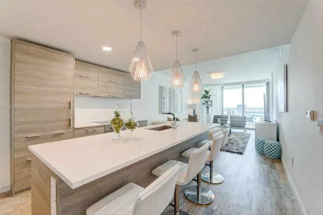 a kitchen with a table and chairs