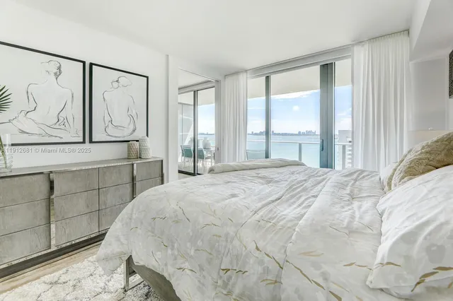 a spacious bedroom with a bed and a desk