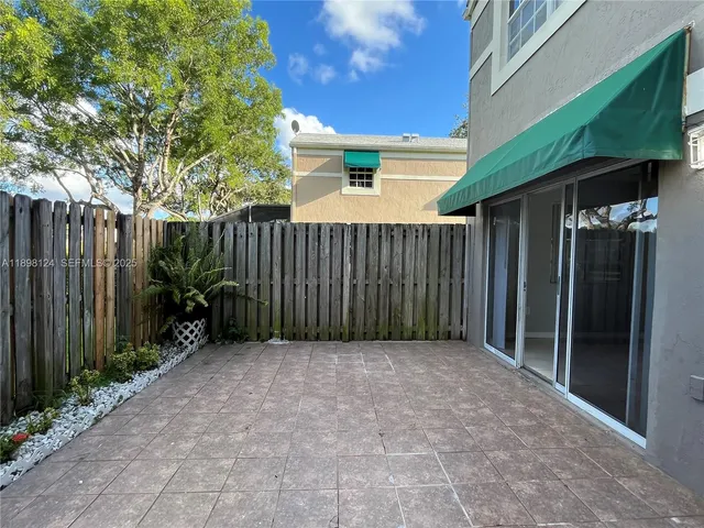 a view of backyard with green space
