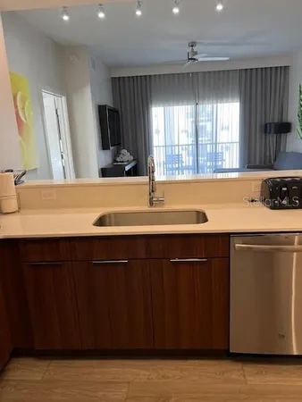 a kitchen with a sink and cabinets