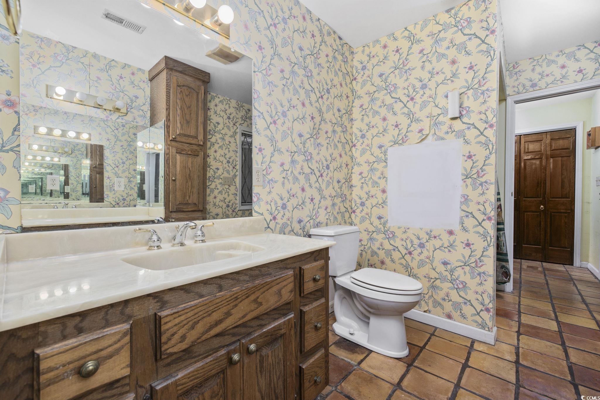 1647 Running Water Road Murrells Inlet, SC 29576 - Photo 16 of 39 Bathroom with tile patterned flooring, vanity, and