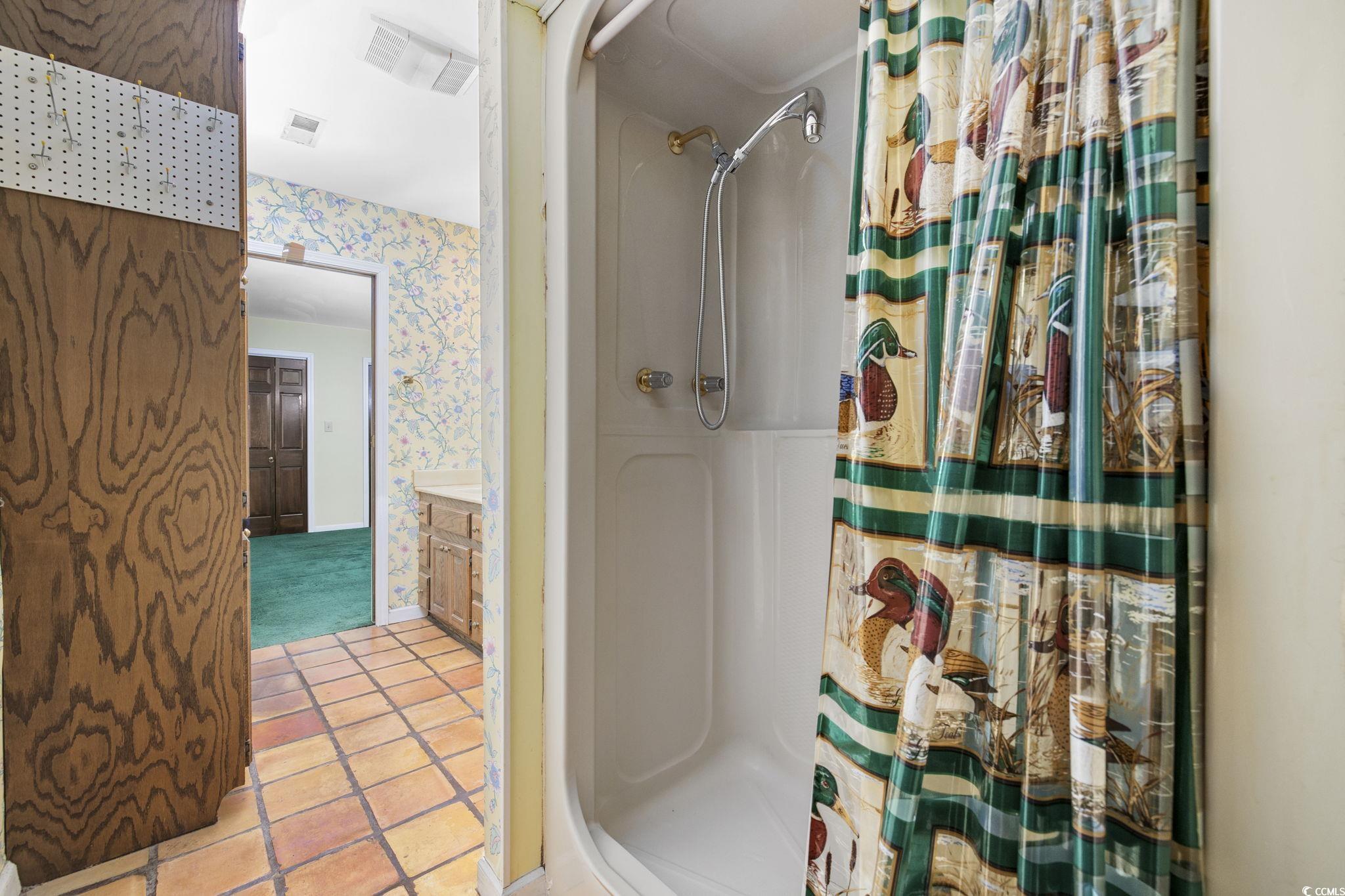 1647 Running Water Road Murrells Inlet, SC 29576 - Photo 17 of 39 Bathroom featuring tile patterned floors and curta