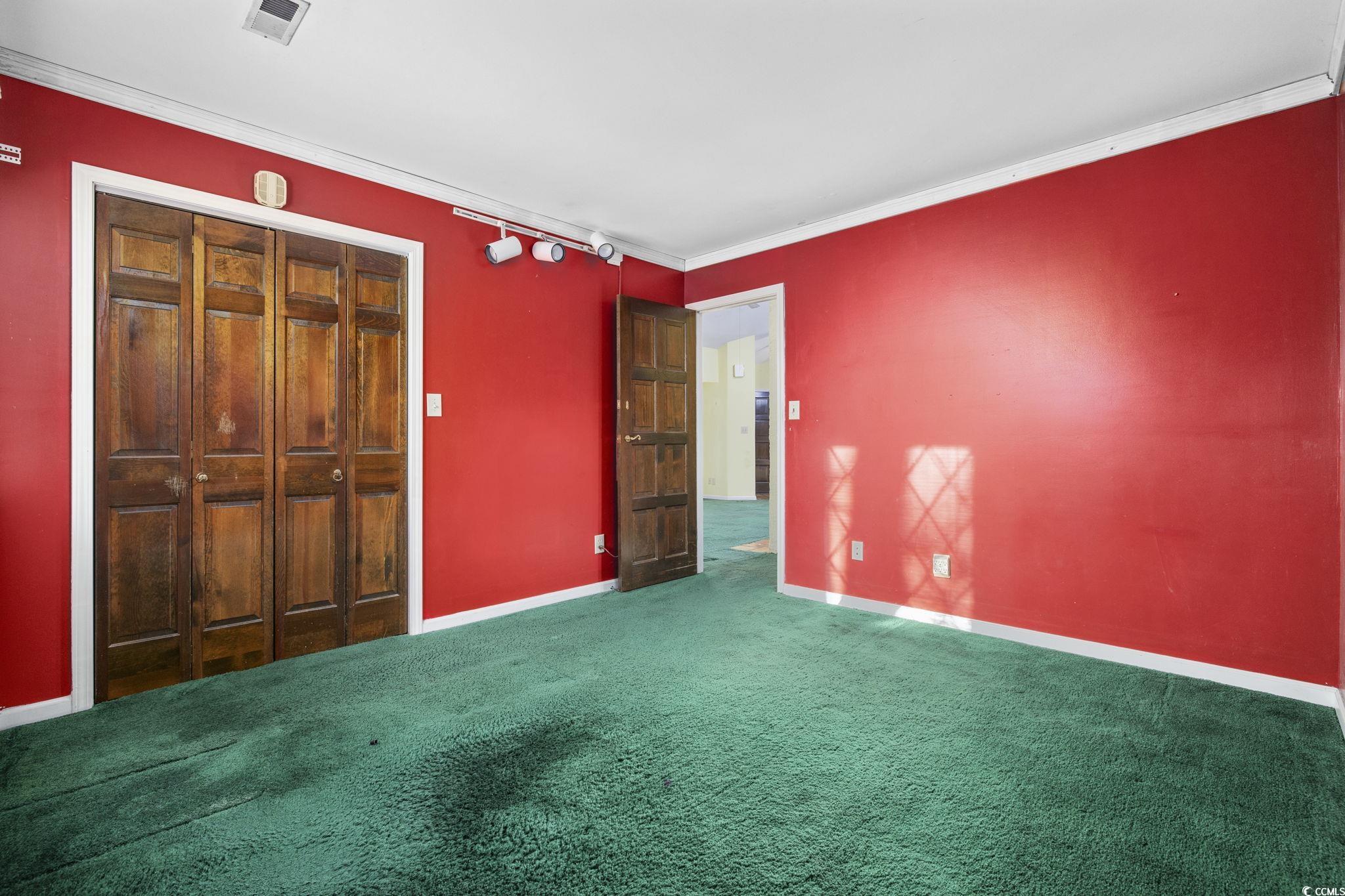 1647 Running Water Road Murrells Inlet, SC 29576 - Photo 23 of 39 Unfurnished bedroom with carpet flooring, ornament