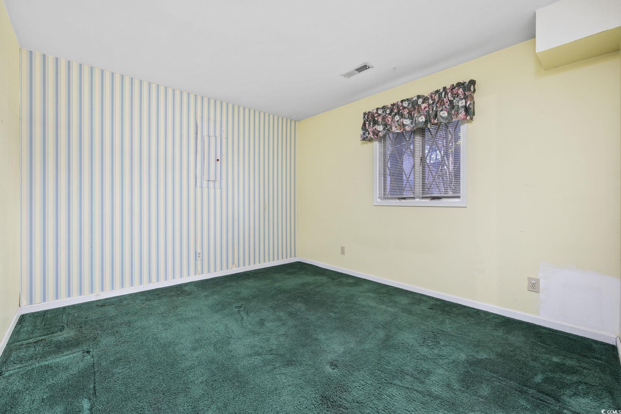 1647 Running Water Road Murrells Inlet, SC 29576 - Photo 24 of 39 Empty room featuring dark colored carpet