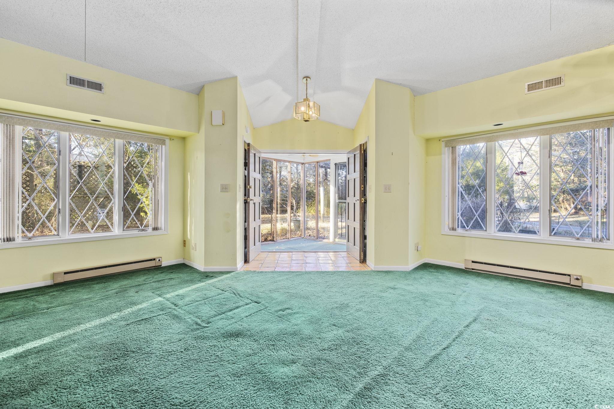 1647 Running Water Road Murrells Inlet, SC 29576 - Photo 5 of 39 Unfurnished living room featuring carpet flooring,