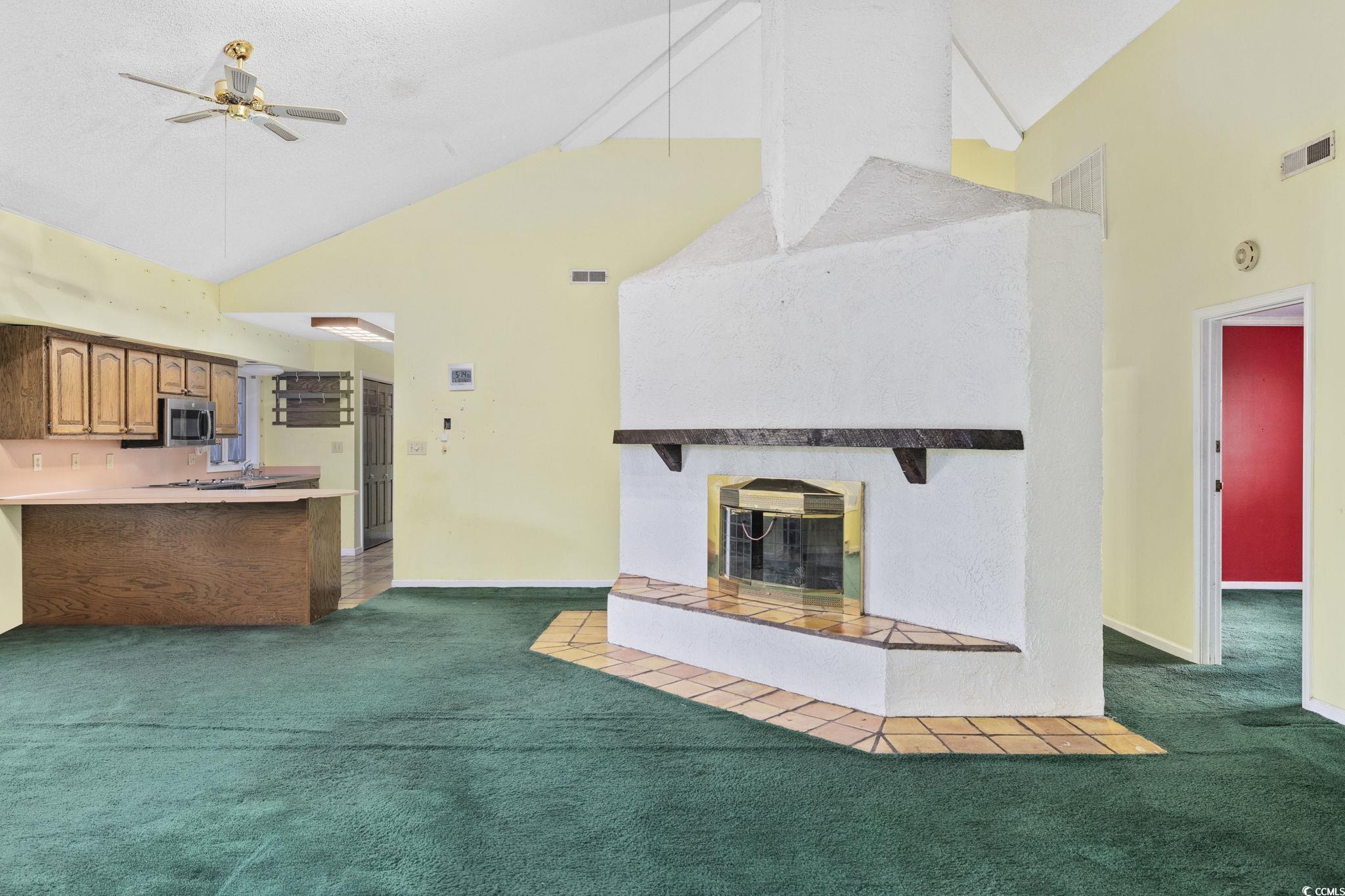 1647 Running Water Road Murrells Inlet, SC 29576 - Photo 6 of 39 Unfurnished living room with ceiling fan, dark car