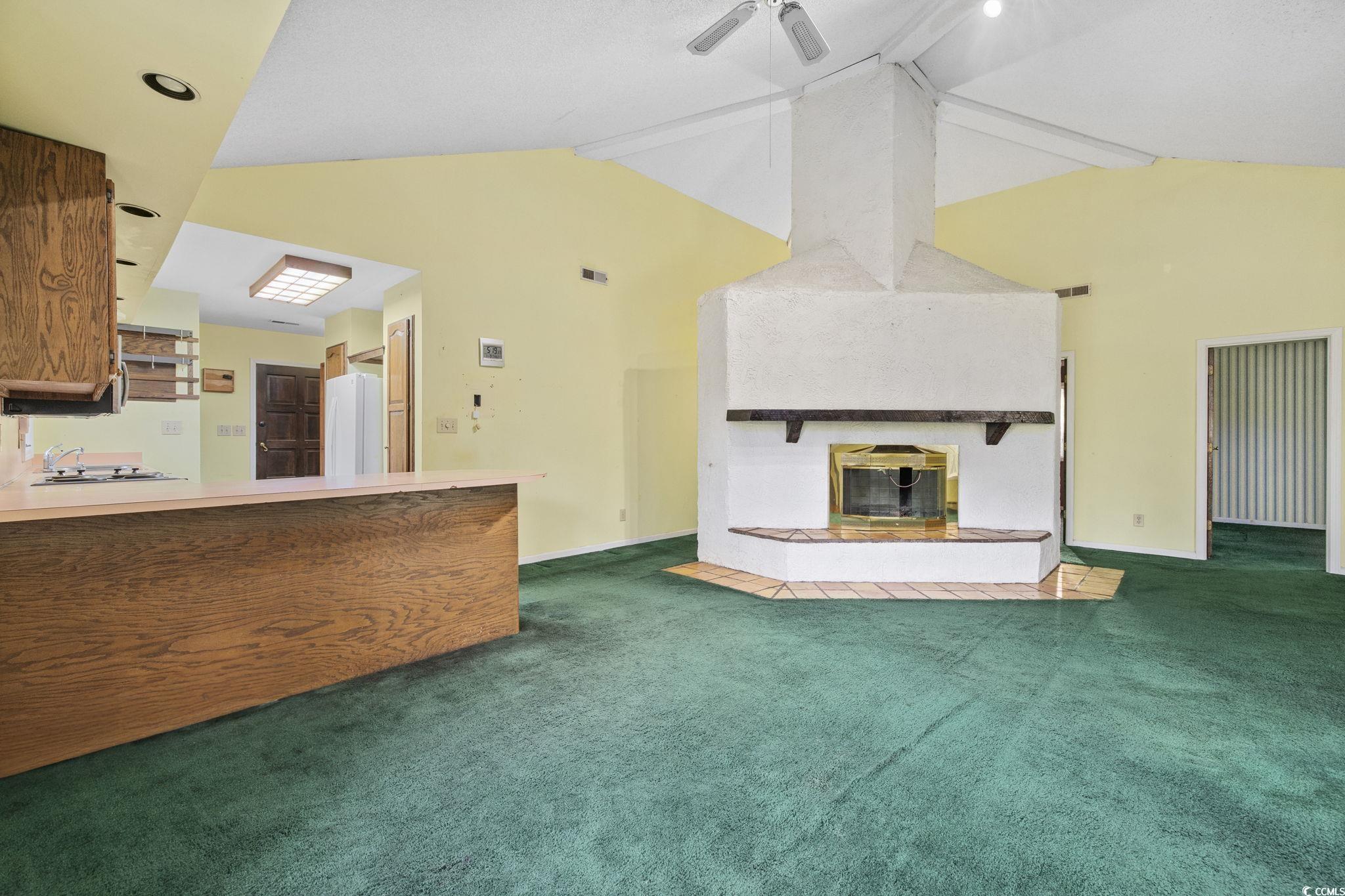 1647 Running Water Road Murrells Inlet, SC 29576 - Photo 8 of 39 Unfurnished living room featuring lofted ceiling w