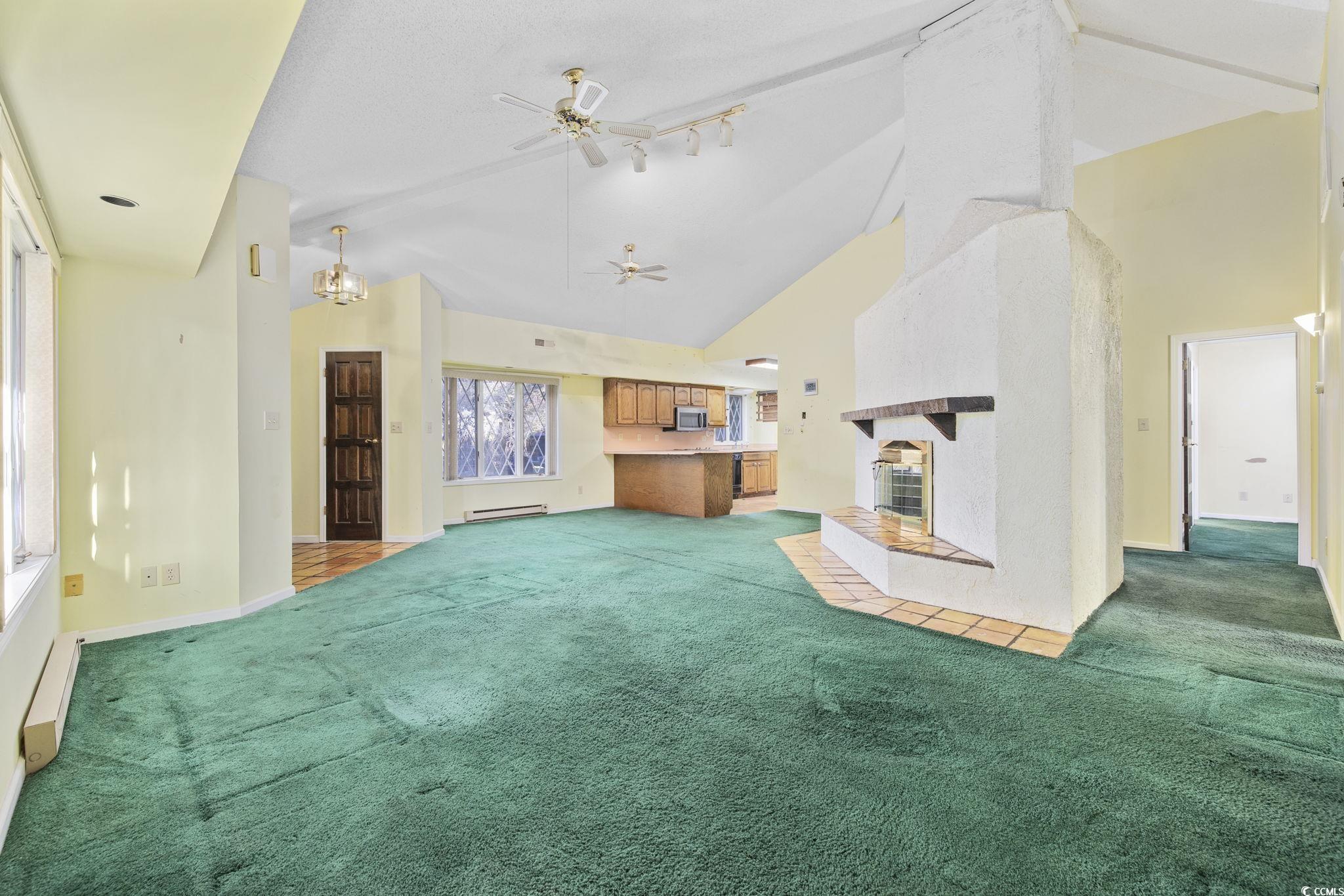 1647 Running Water Road Murrells Inlet, SC 29576 - Photo 9 of 39 Unfurnished living room with light carpet, a baseb