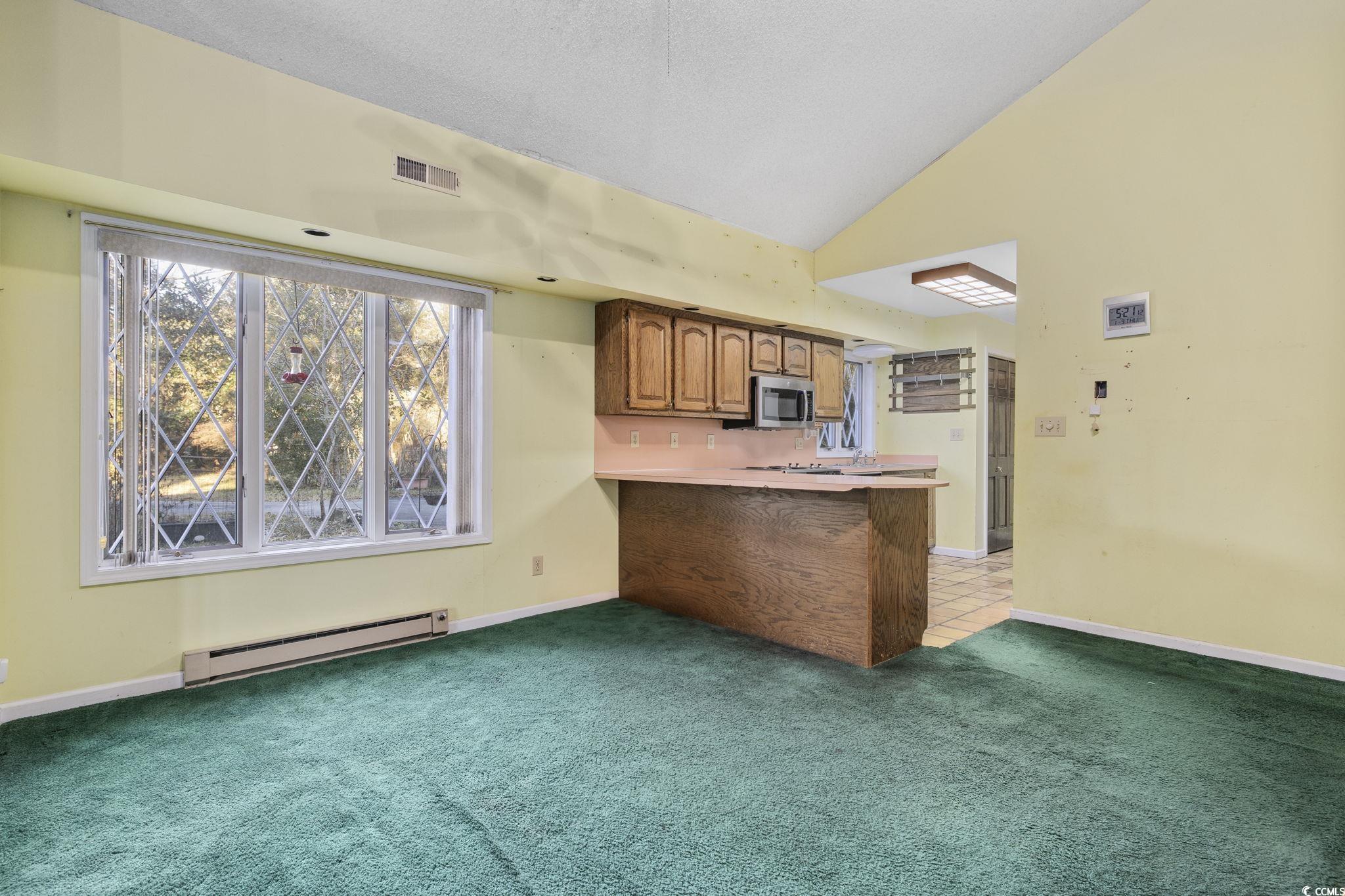 1647 Running Water Road Murrells Inlet, SC 29576 - Photo 10 of 39 Kitchen featuring light carpet, a kitchen breakfas