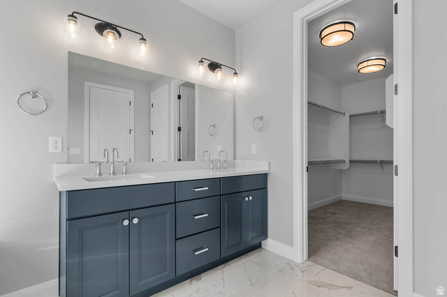 11673 South Halls Crk Road Draper, UT 84020 - Photo 21 of 22 Double vanity featuring a white countertop and navy cabinetry with brushed nickel hardware