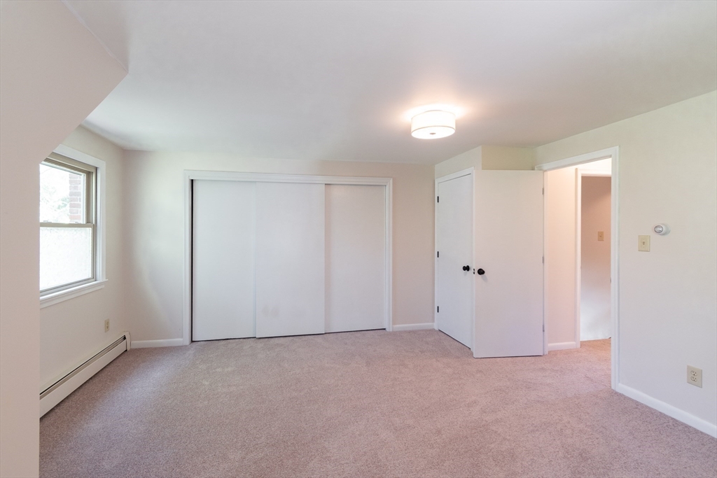 60 Crooked Spring Road North Chelmsford, MA 01863 - Photo 17 of 25 a view of an empty room and a window