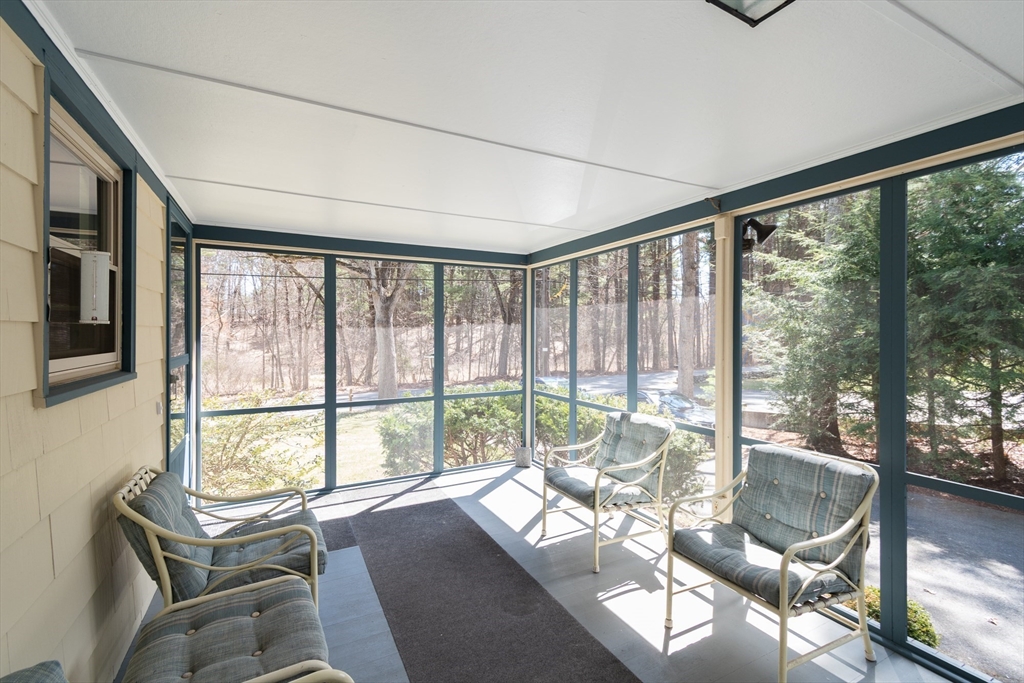 60 Crooked Spring Road North Chelmsford, MA 01863 - Photo 2 of 25 a living room with furniture and floor to ceiling windows