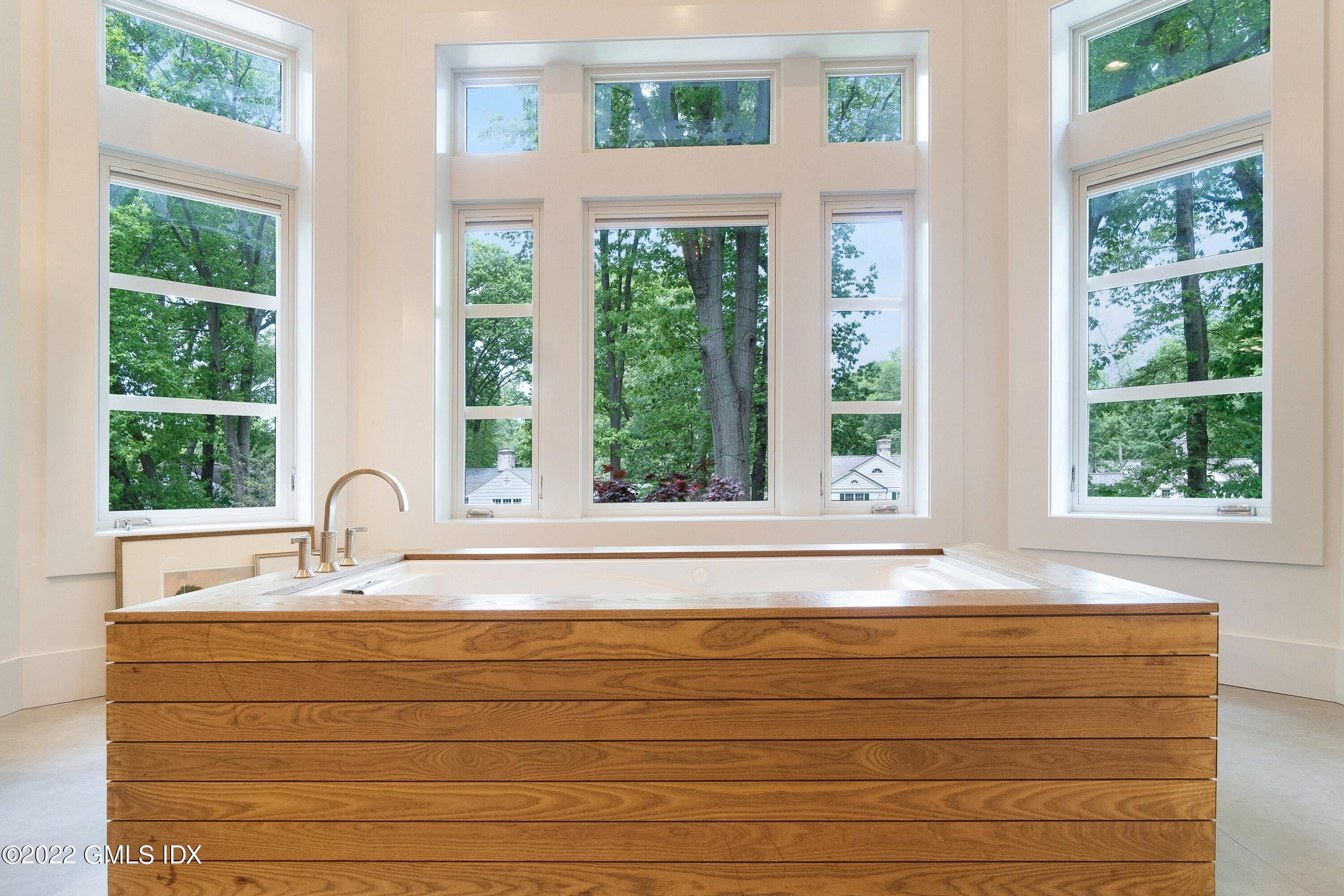 22 Oak Drive Riverside, CT 06878 - Photo 19 of 40 a bathroom with a sink mirror and a window