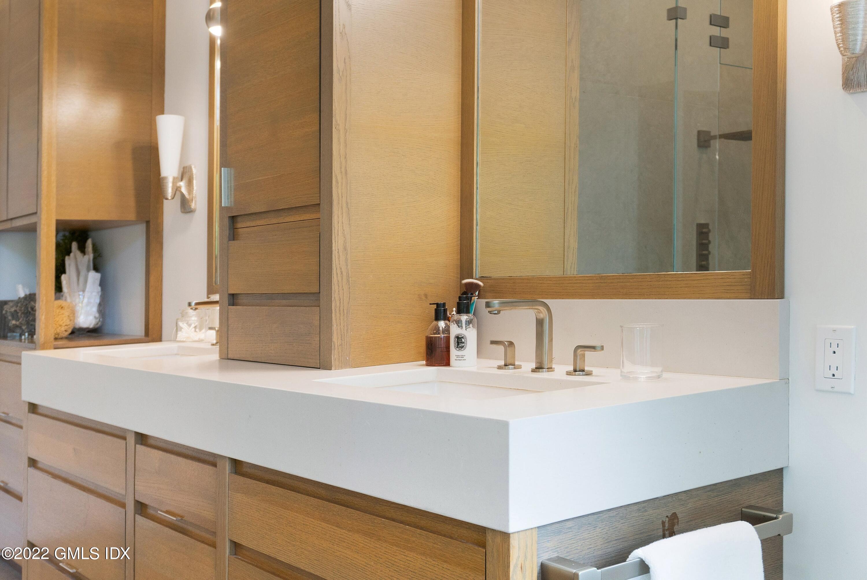 22 Oak Drive Riverside, CT 06878 - Photo 21 of 40 a bathroom with a sink and a mirror