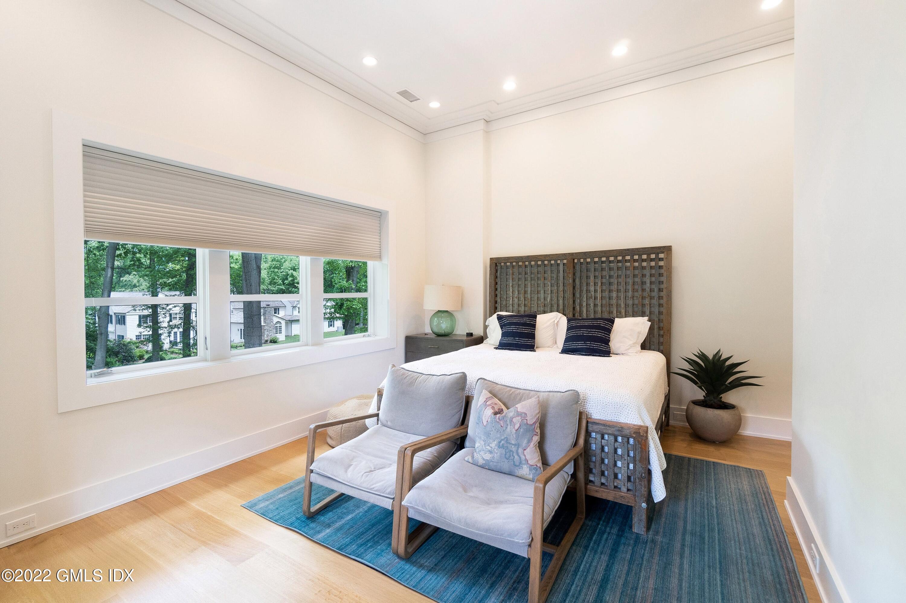 22 Oak Drive Riverside, CT 06878 - Photo 24 of 40 a bed room with a bed and a chair