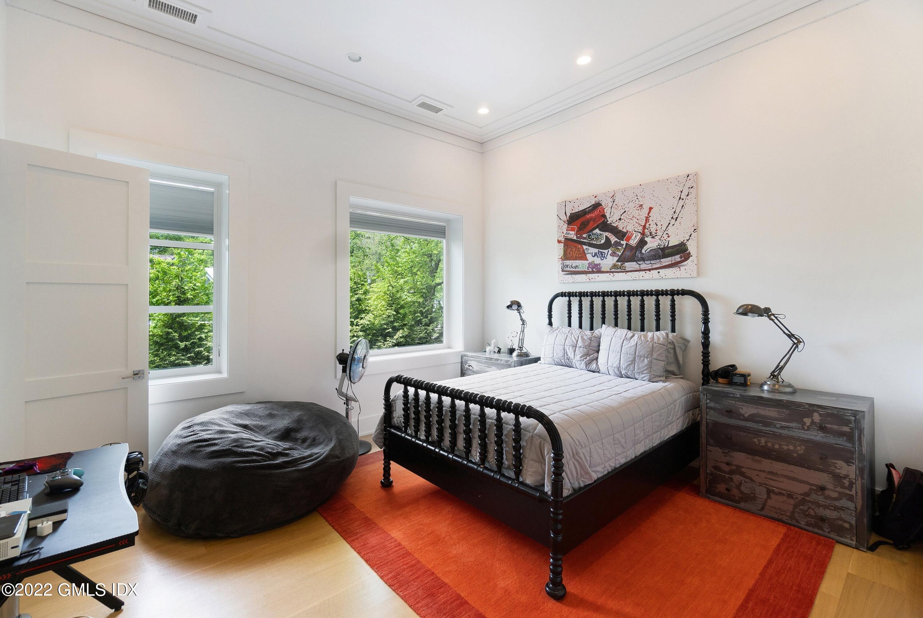 22 Oak Drive Riverside, CT 06878 - Photo 26 of 40 a bedroom with a bed and a window