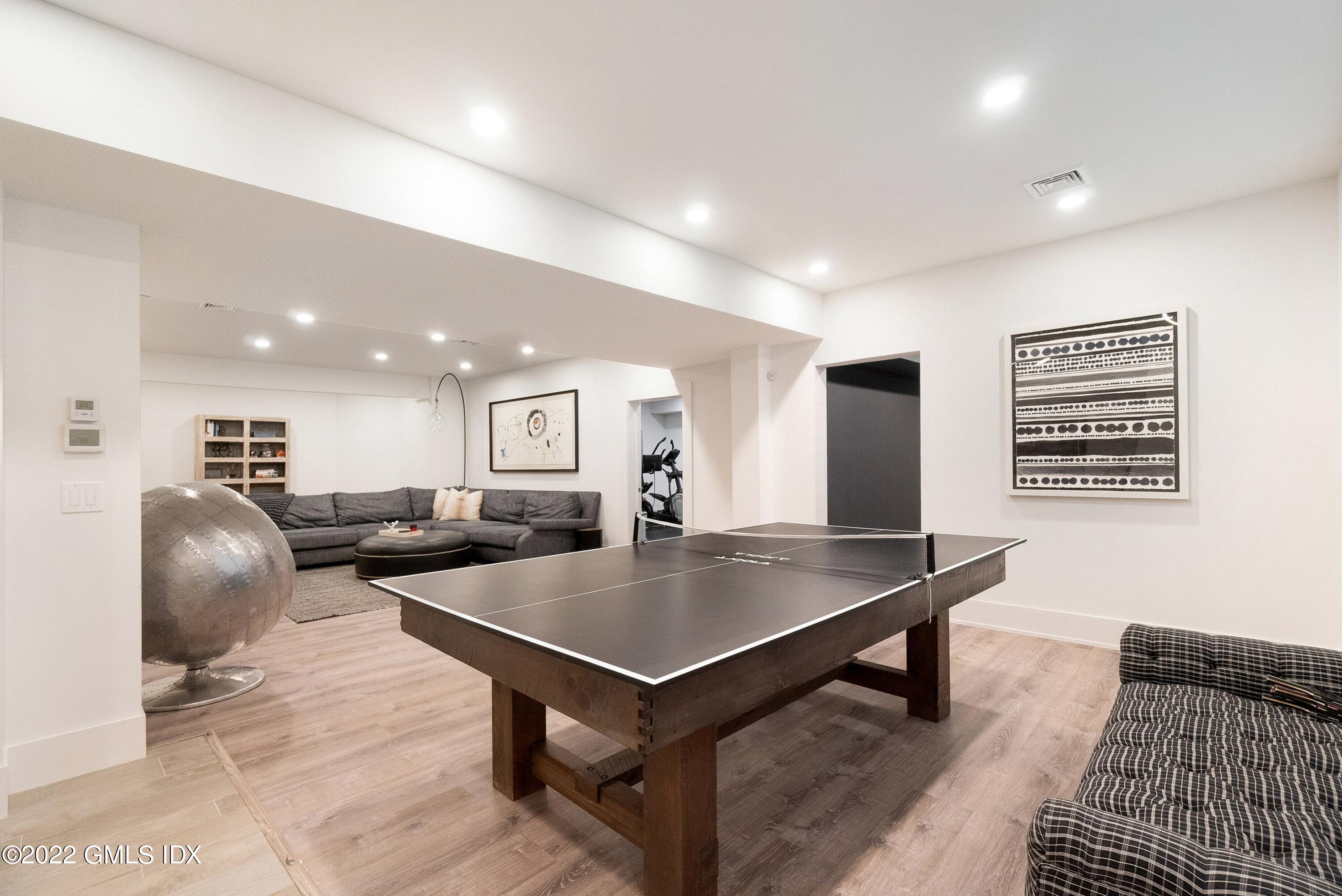 22 Oak Drive Riverside, CT 06878 - Photo 29 of 40 a living room with furniture a table and chairs