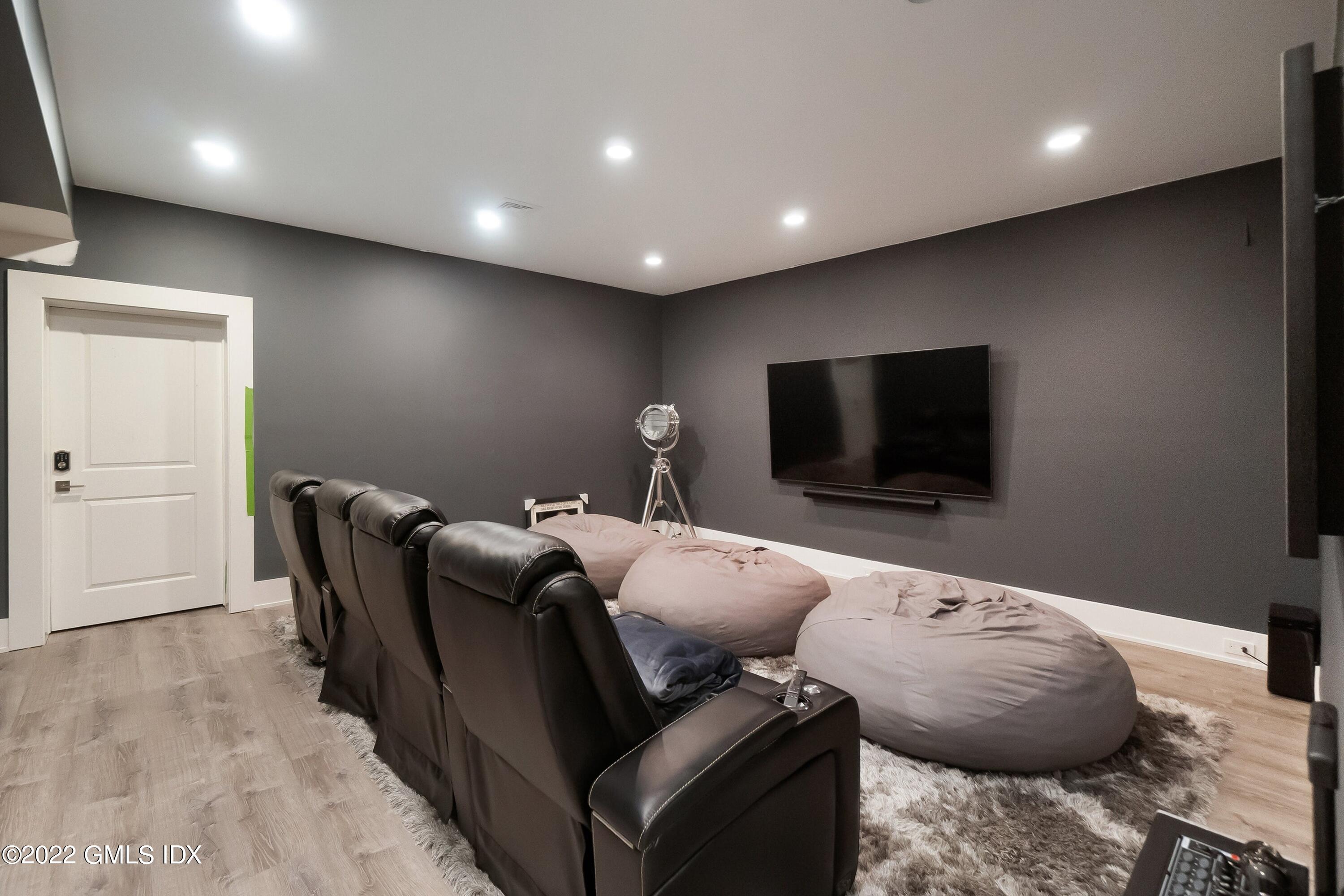 22 Oak Drive Riverside, CT 06878 - Photo 30 of 40 a living room with furniture and a flat screen tv