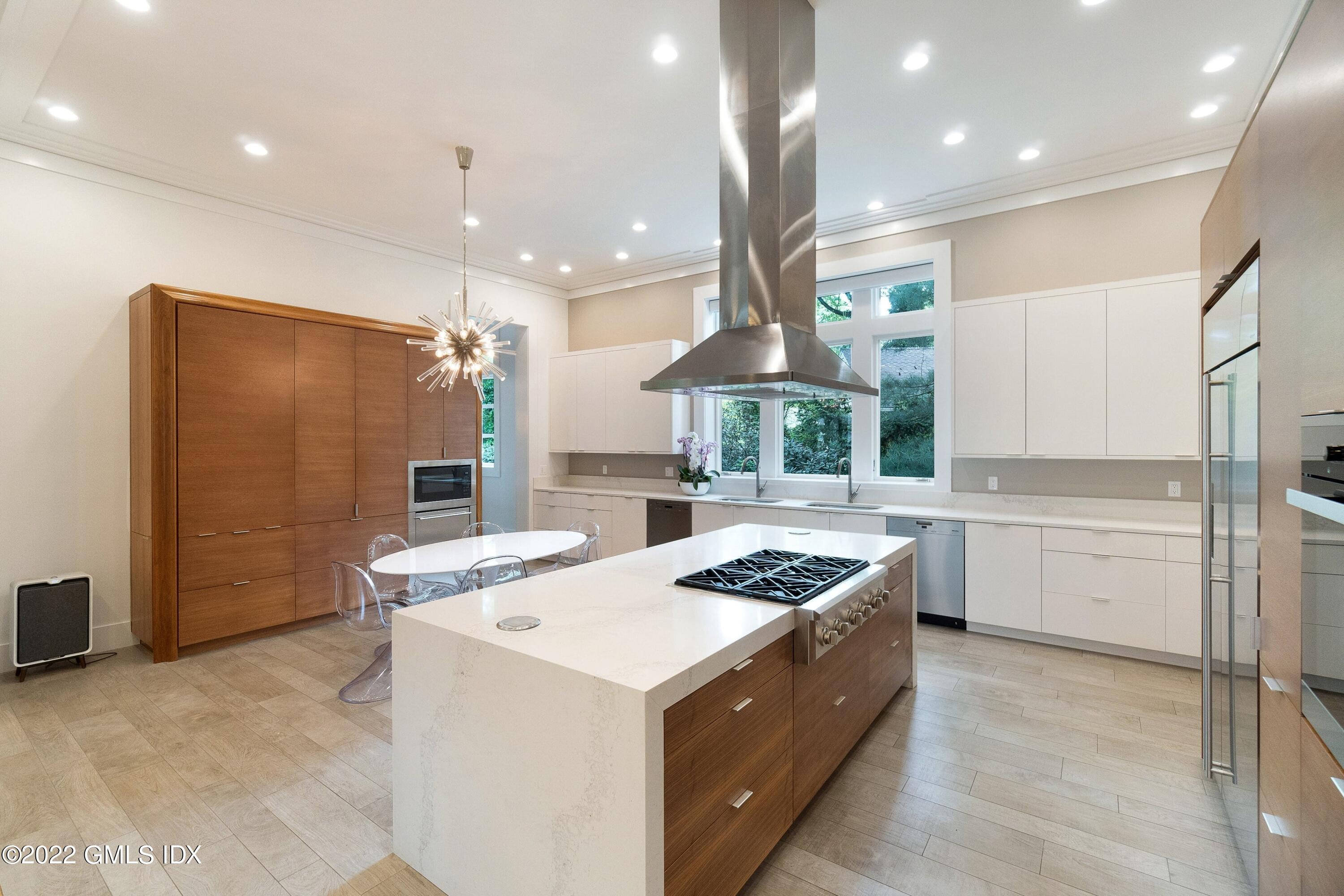 22 Oak Drive Riverside, CT 06878 - Photo 5 of 40 a kitchen that has a sink a refrigerator and cabinets