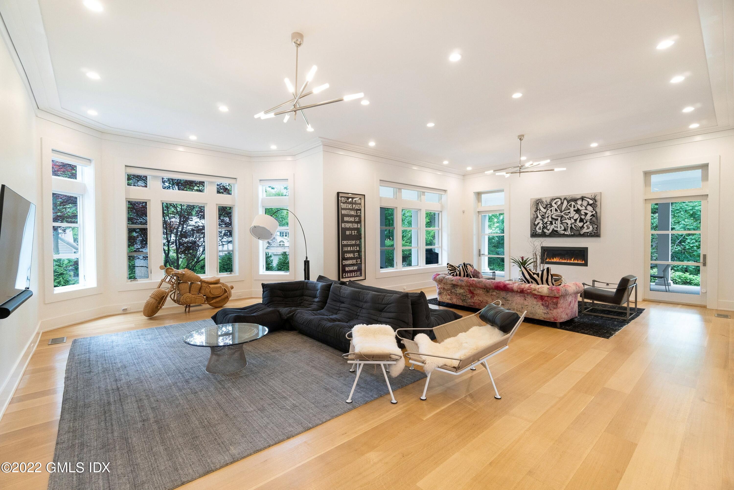 22 Oak Drive Riverside, CT 06878 - Photo 9 of 40 a living room with furniture and large windows
