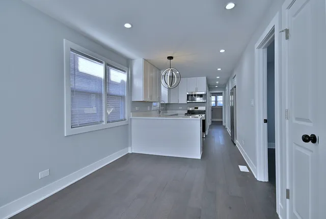 a view of a kitchen and window