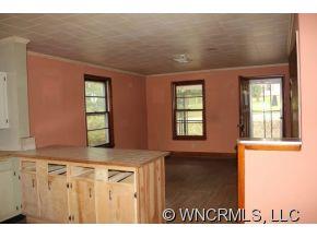 108 Branch Street Rutherfordton, NC 28139 - Photo 3 of 9 a view of an empty room with a window