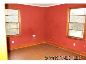 108 Branch Street Rutherfordton, NC 28139 - Photo 6 of 9 a view of an empty room with a window