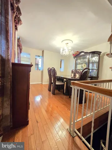a kitchen with a stove a sink and a window