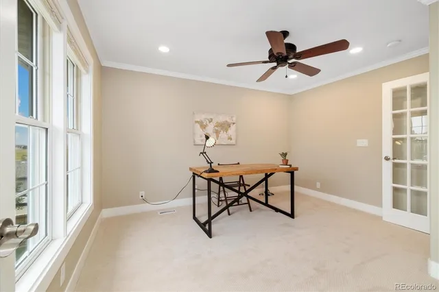 a bathroom with a granite countertop toilet sink and mirror