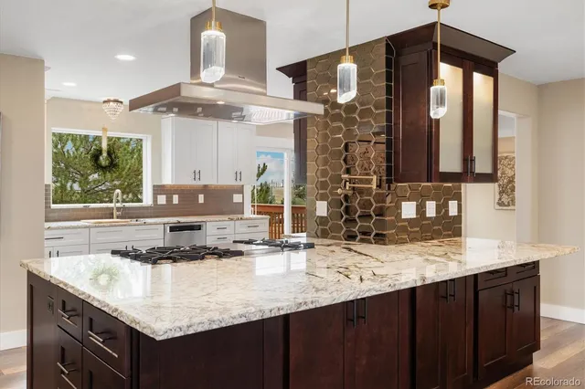 a kitchen with granite countertop a sink and a cabinets