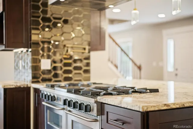 a kitchen with a stove and a sink