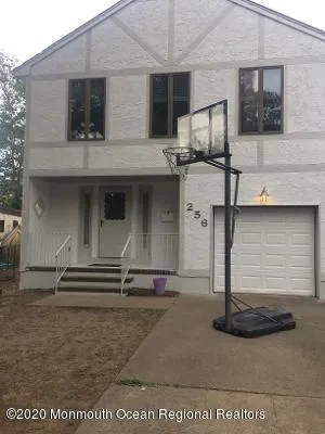 a front view of a house with garage