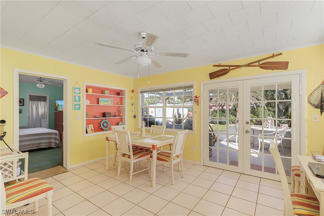 5776 Tarpon Road Bokeelia, FL 33922 - Photo 16 of 31 a dining room with furniture and window