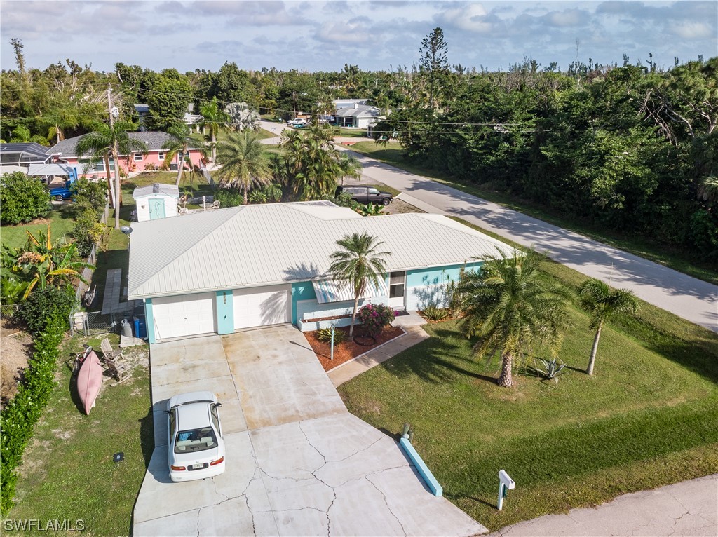 5776 Tarpon Road Bokeelia, FL 33922 - Photo 3 of 31 an aerial view of a house with outdoor space