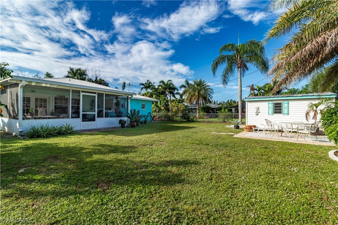 5776 Tarpon Road Bokeelia, FL 33922 - Photo 31 of 31 a view of a house with a backyard