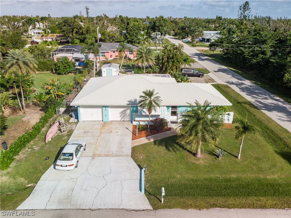 5776 Tarpon Road Bokeelia, FL 33922 - Photo 4 of 31 an aerial view of a house with a yard