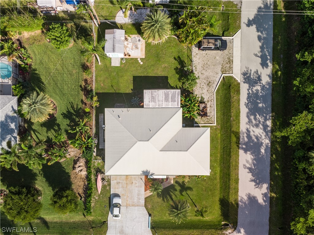 5776 Tarpon Road Bokeelia, FL 33922 - Photo 6 of 31 an aerial view of a house with a garden