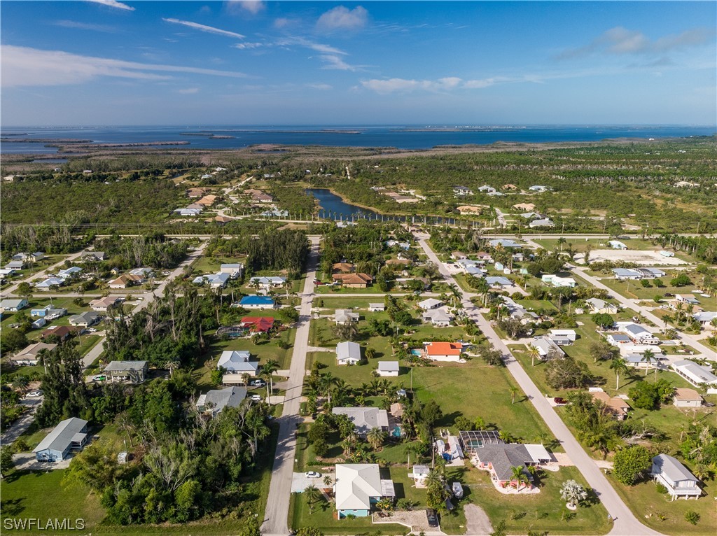 5776 Tarpon Road Bokeelia, FL 33922 - Photo 8 of 31 an aerial view of residential building and green space