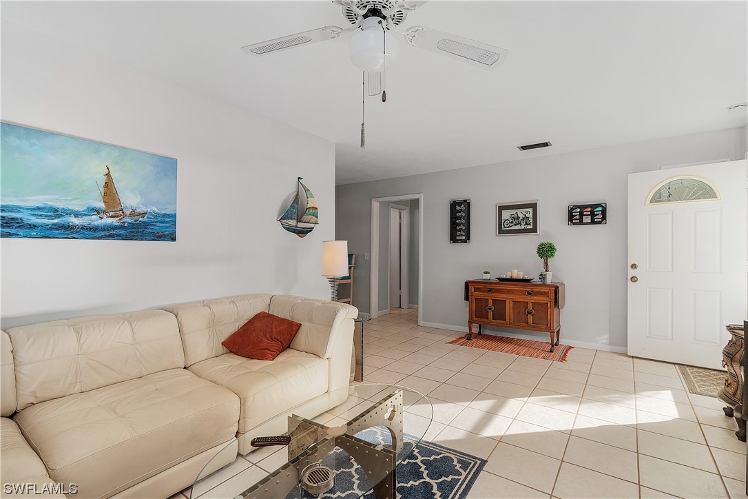5776 Tarpon Road Bokeelia, FL 33922 - Photo 10 of 31 a living room with furniture and a table