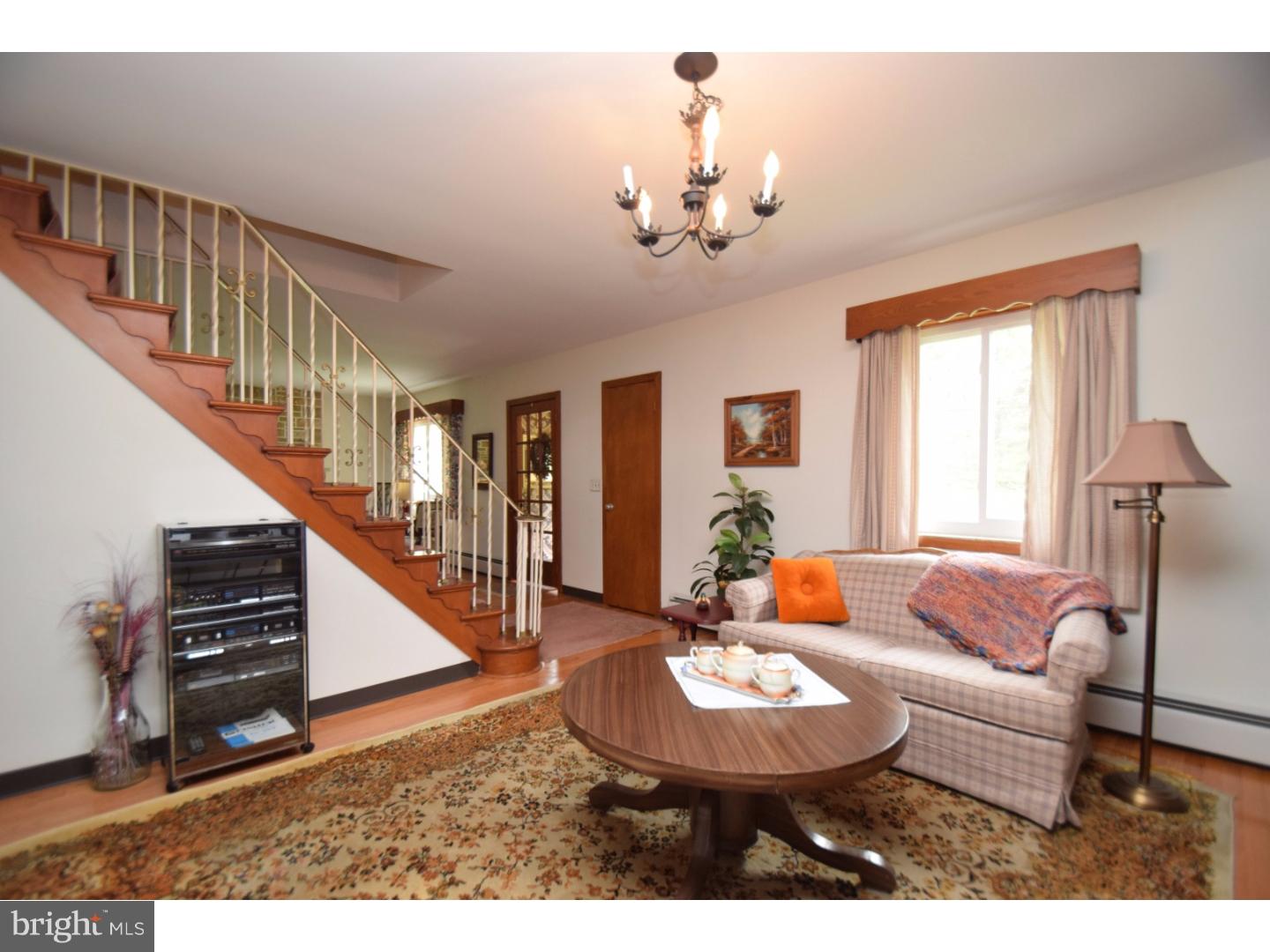 2564 Welshtown Road Slatington, PA 18080 - Photo 8 of 25 a living room with furniture and a chandelier